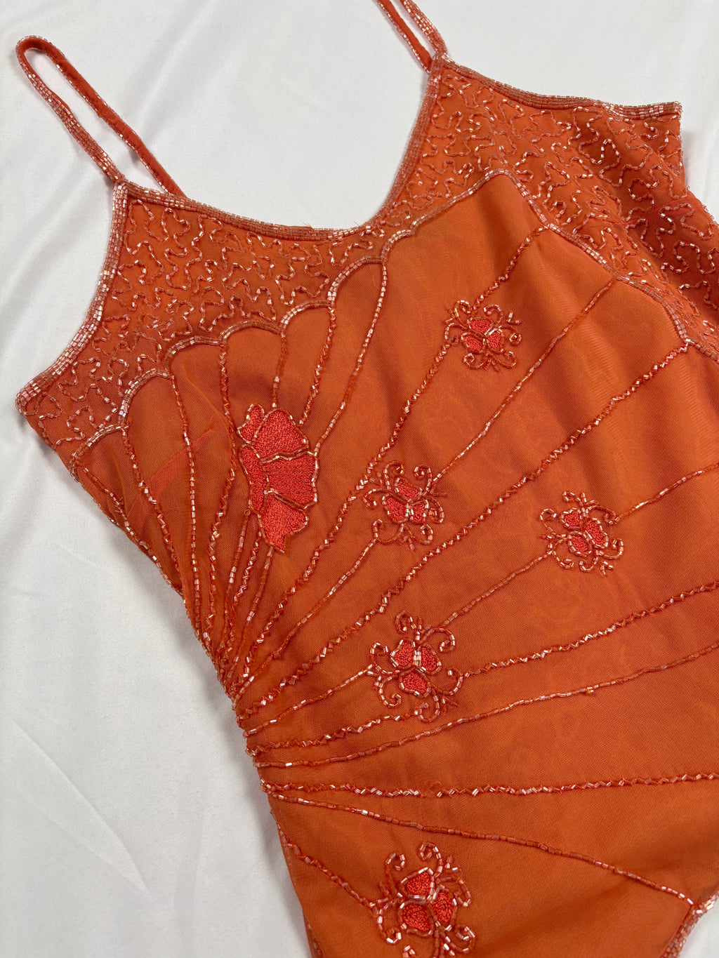 Orange asymmetric cut cami embellished with beads
