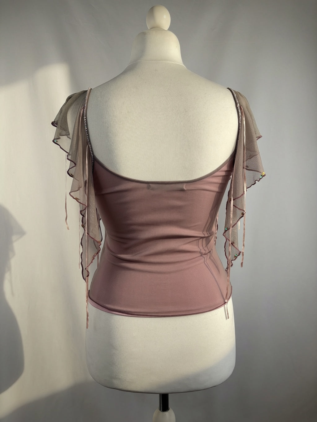 Muted purple ruffle sleeve top with embroidered sequin details