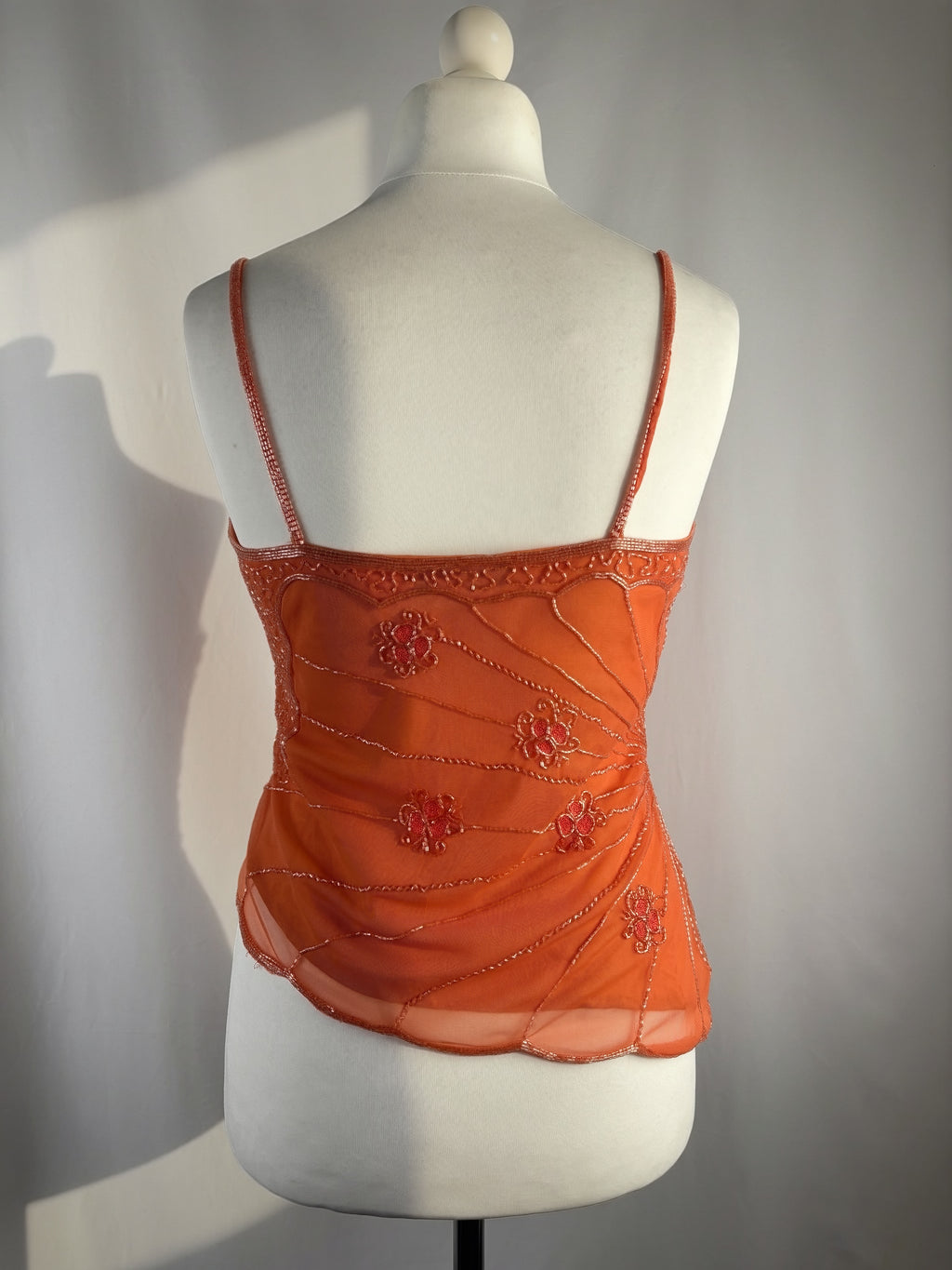 Orange asymmetric cut cami embellished with beads