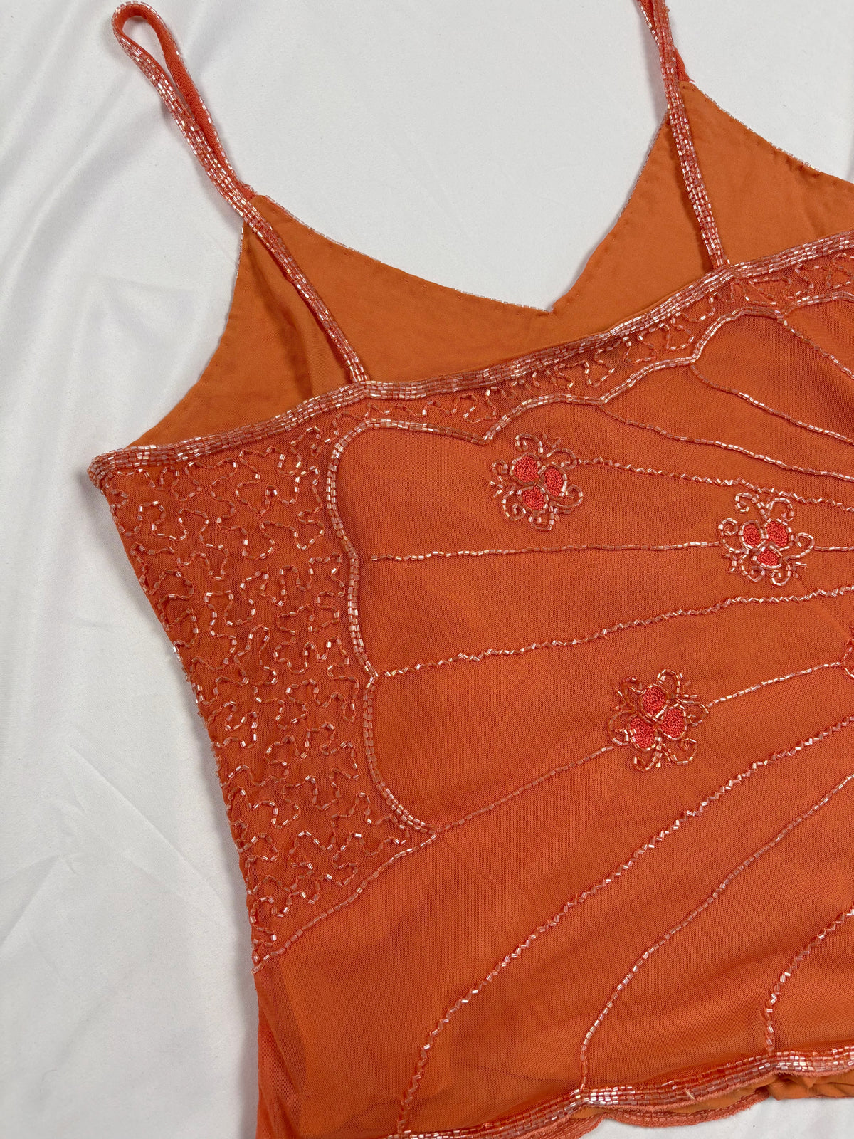 Orange asymmetric cut cami embellished with beads