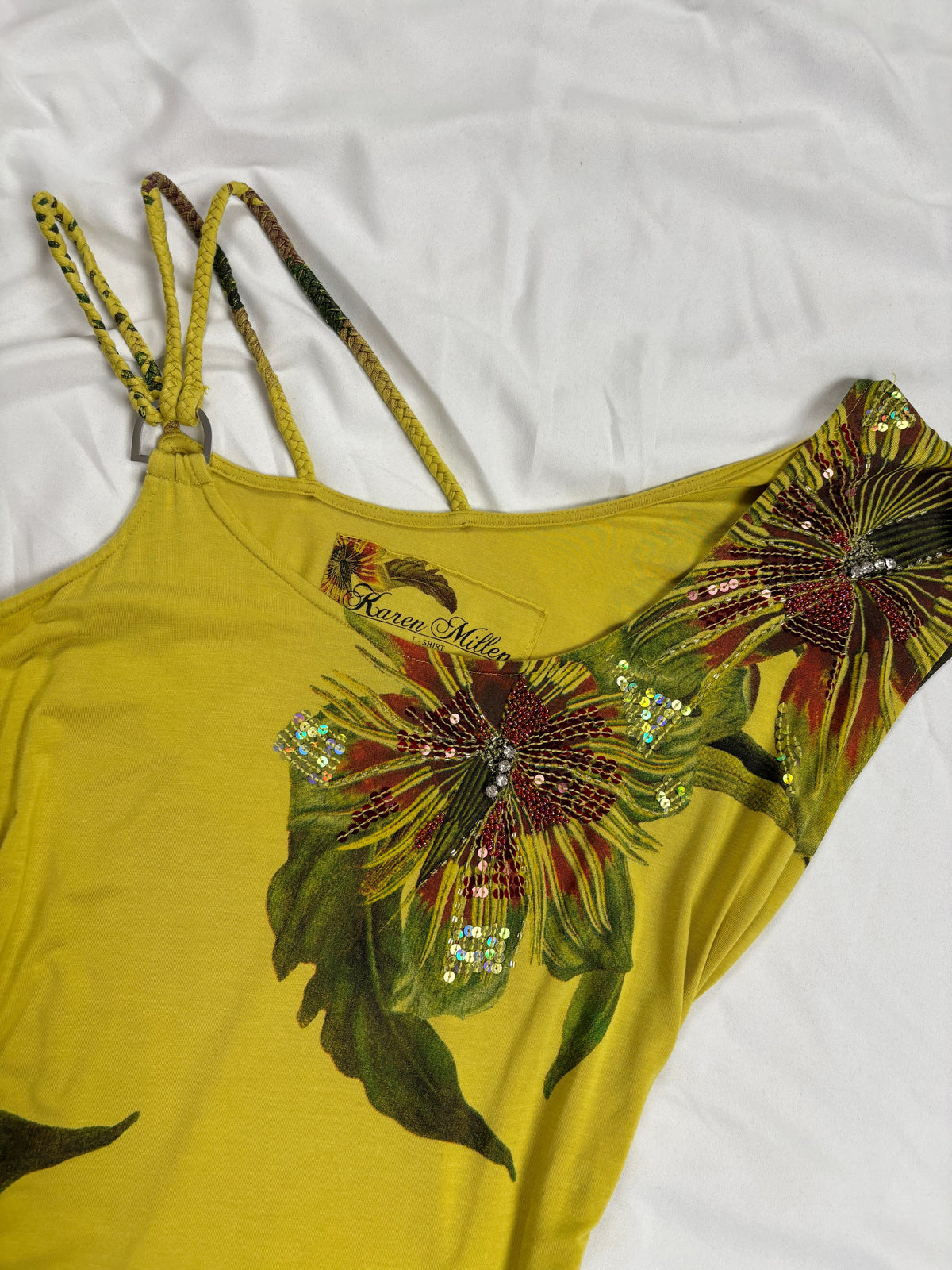Green asymmetrical tropical print embellished top with shoulder strap detail