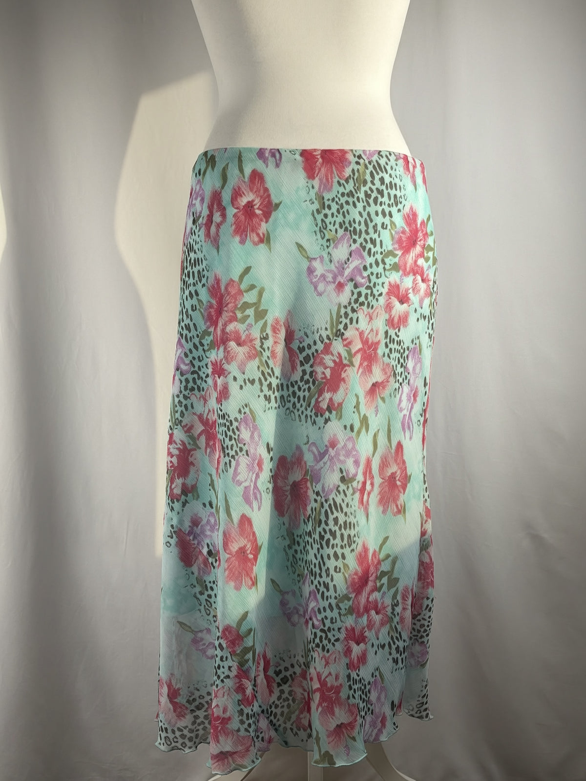 Light blue floral/ animal print skirt with ruffle detail