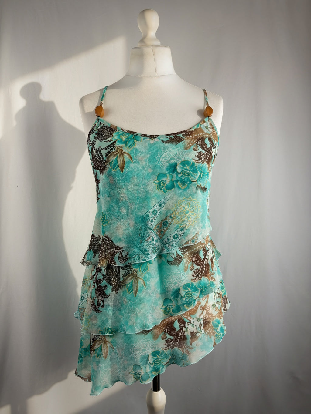 Blue and brown floral tiered ruffle cami with wooden bead details