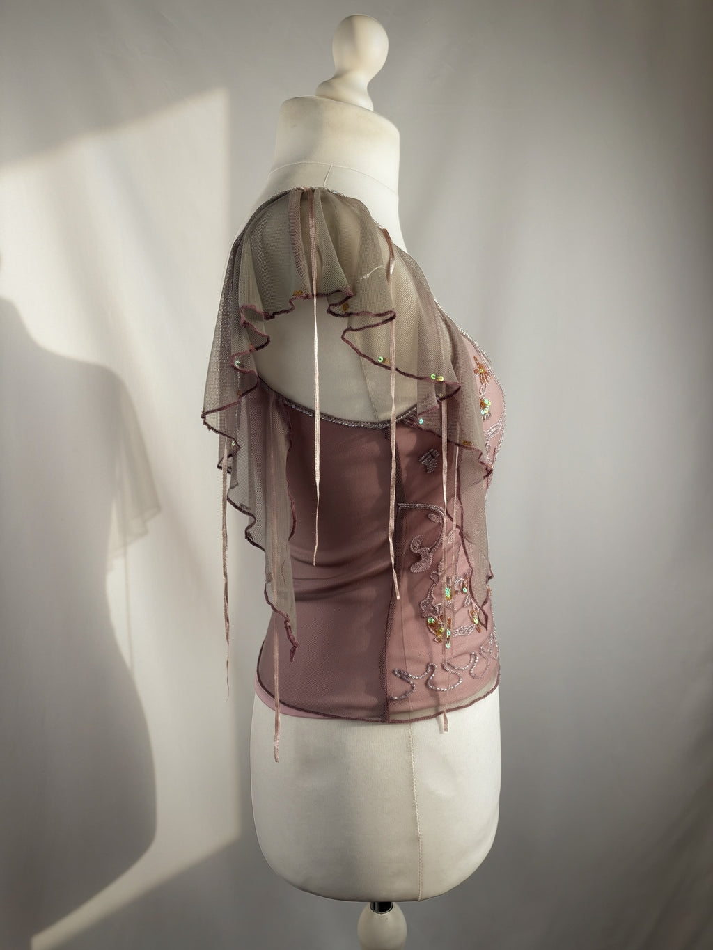 Muted purple ruffle sleeve top with embroidered sequin details