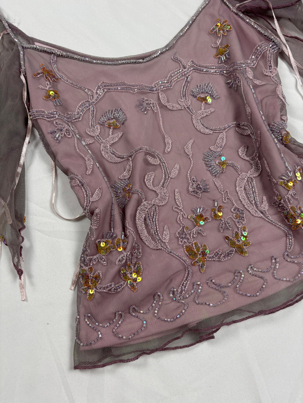 Muted purple ruffle sleeve top with embroidered sequin details
