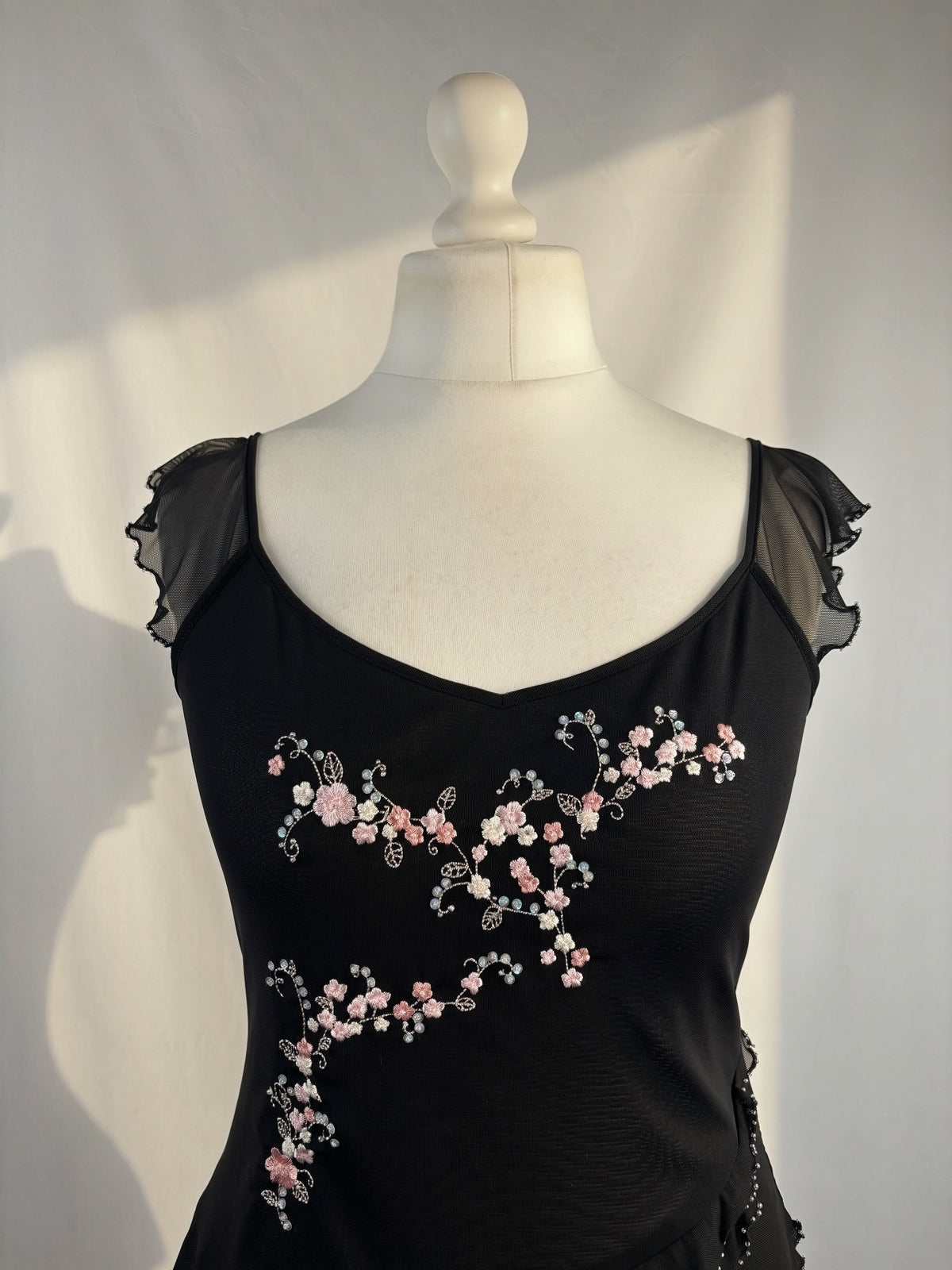 Black milkmaid neckline top with embellished cherry blossom details