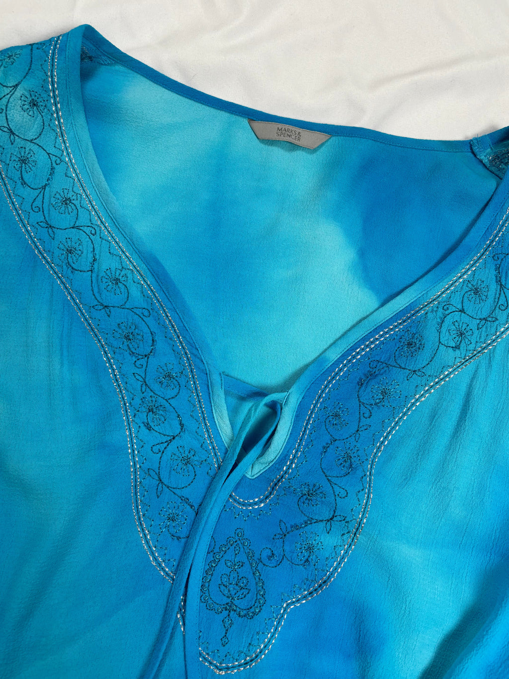 Blue ombré long sleeve top with embroidery details