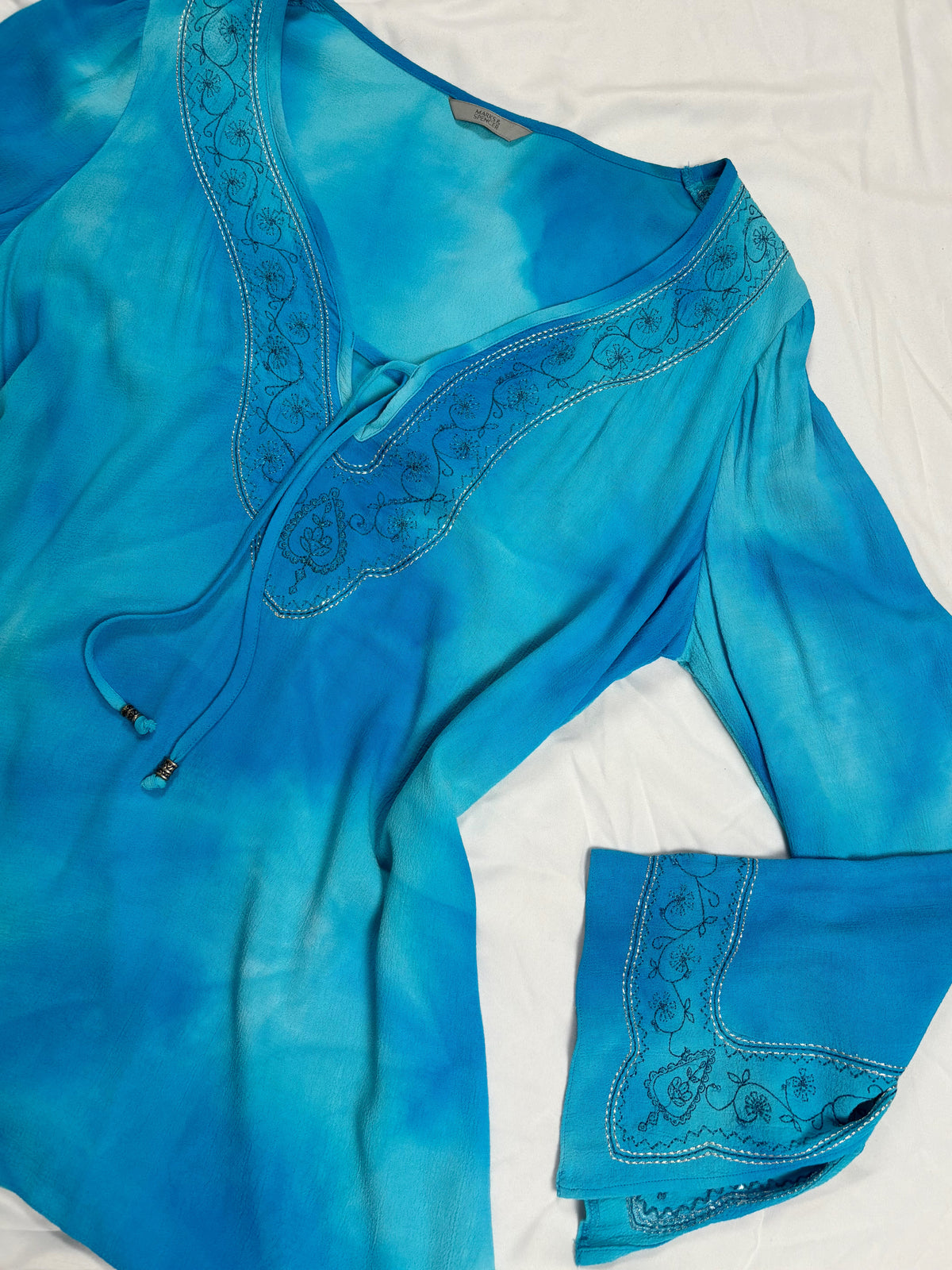 Blue ombré long sleeve top with embroidery details