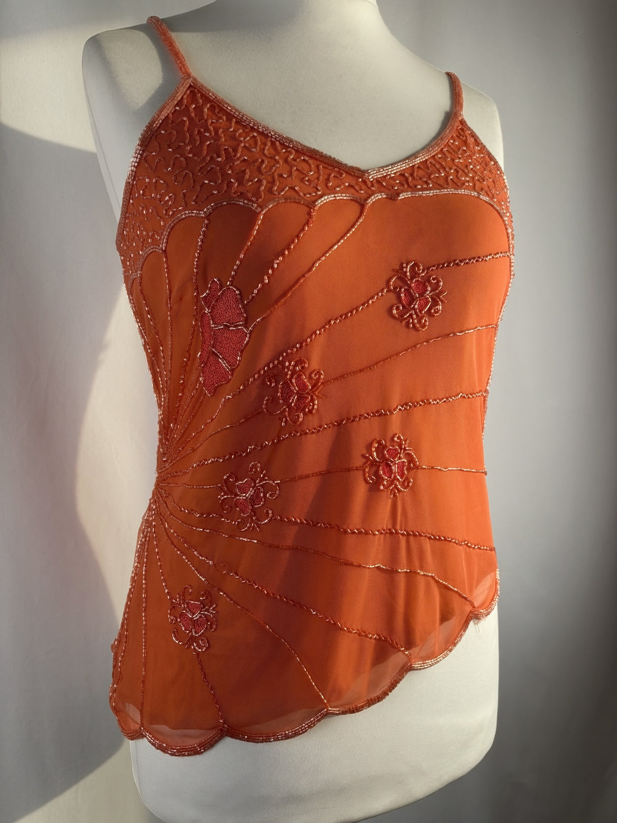 Orange asymmetric cut cami embellished with beads