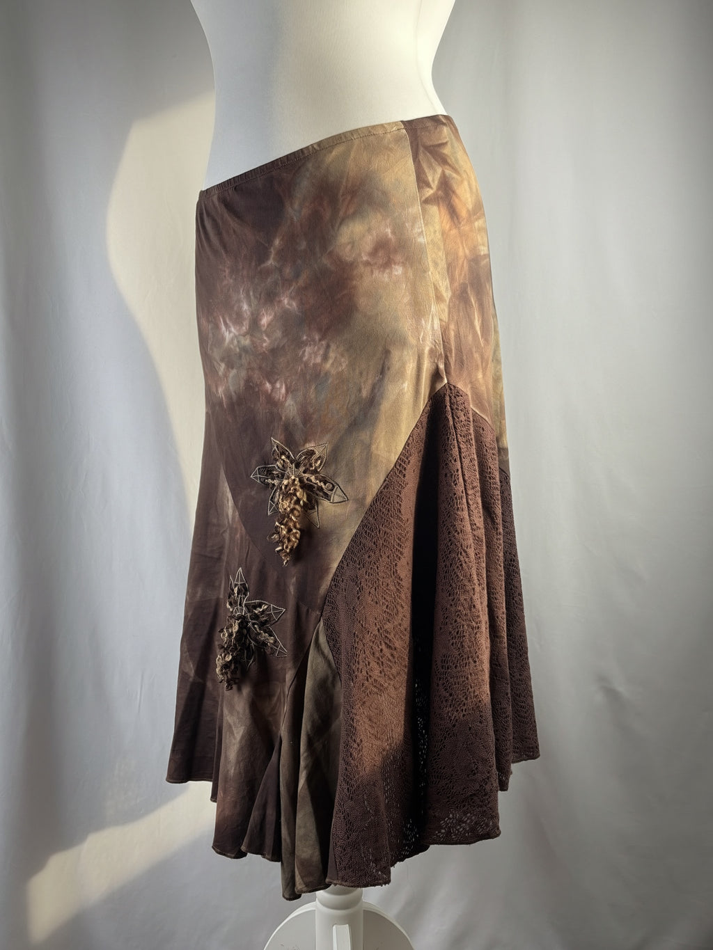 Brown and beige ombré patchwork skirt with floral tassel details