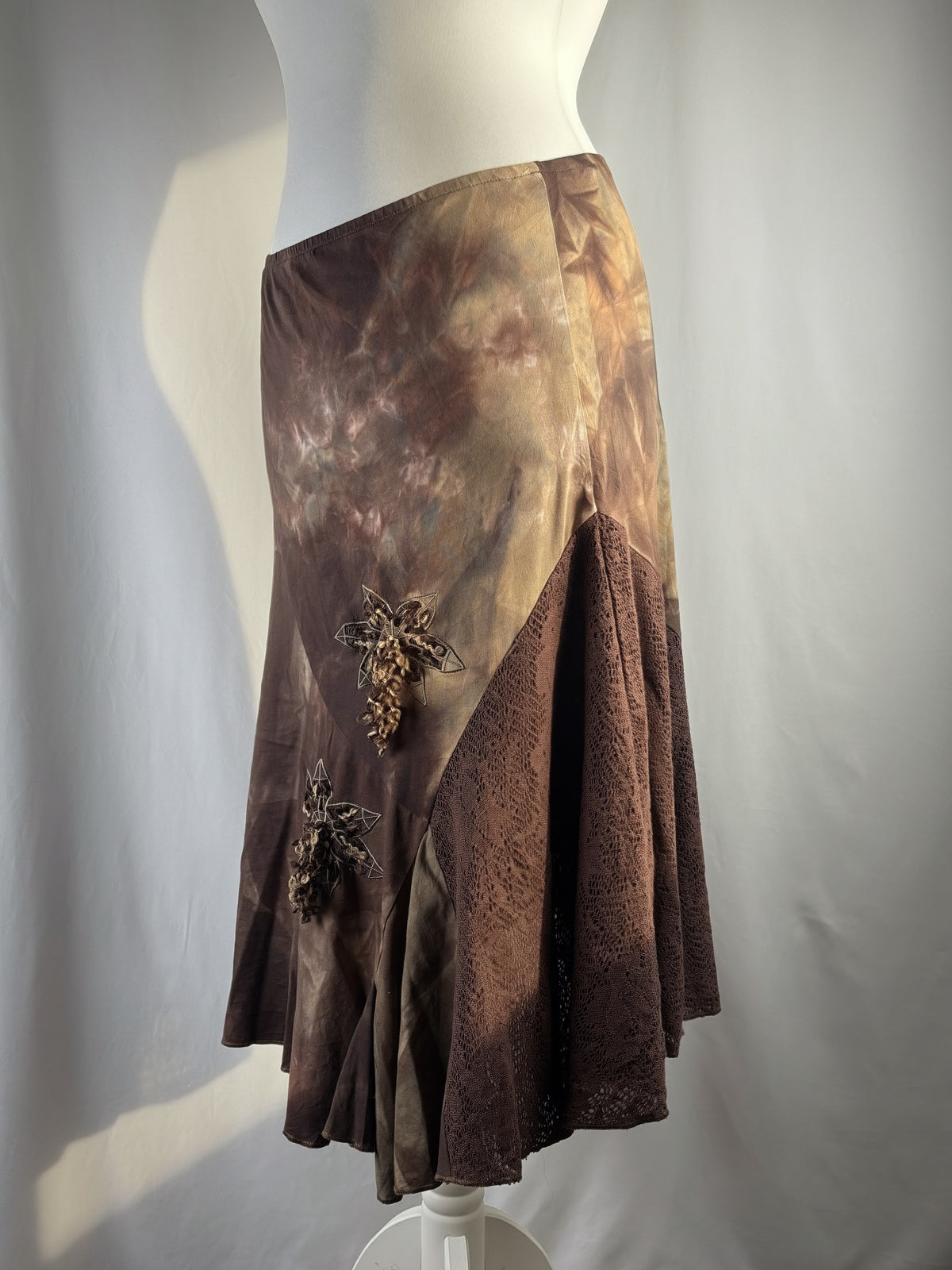 Brown and beige ombré patchwork skirt with floral tassel details