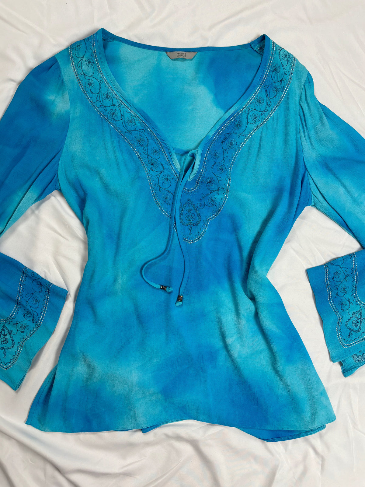 Blue ombré long sleeve top with embroidery details