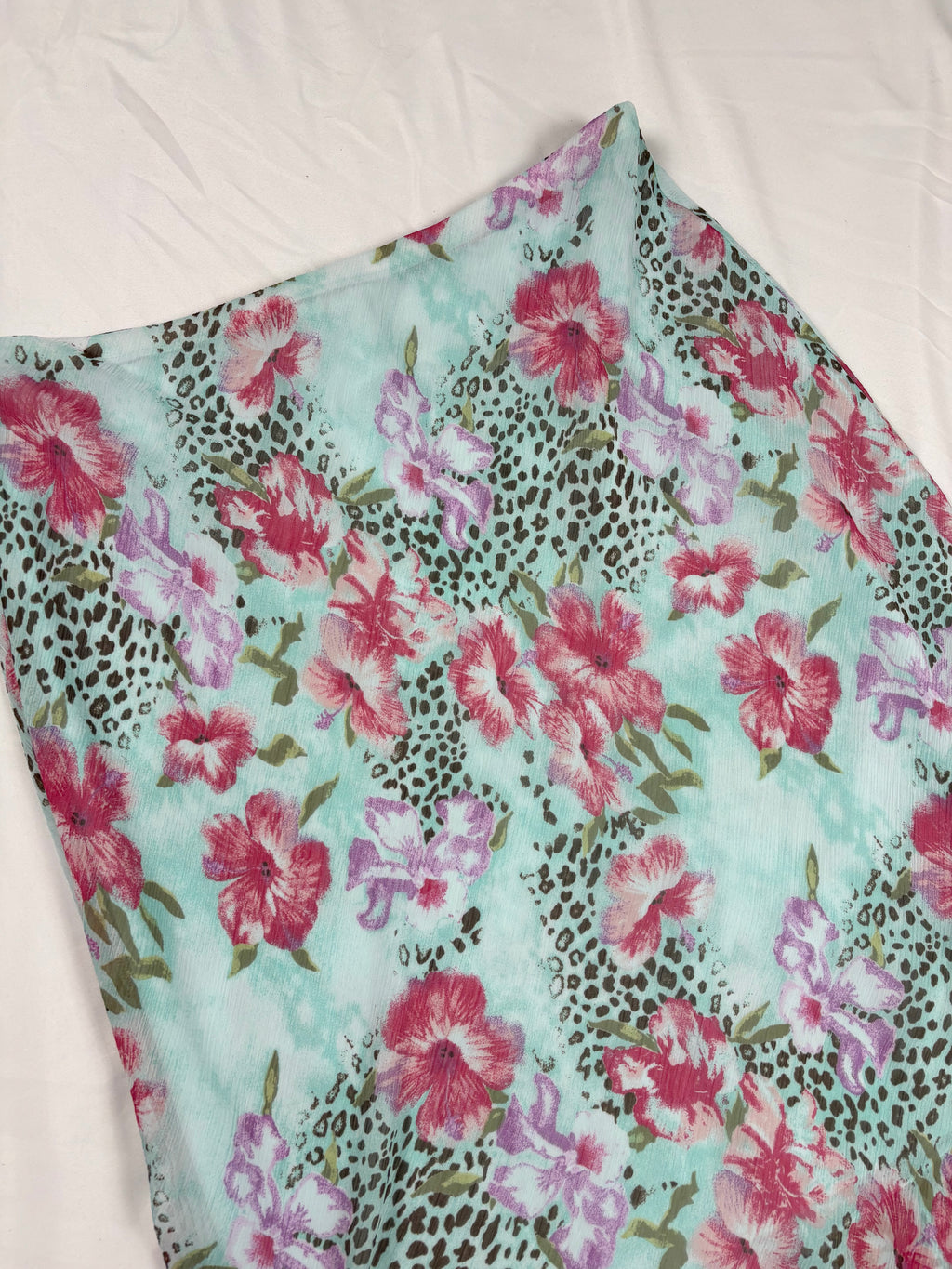 Light blue floral/ animal print skirt with ruffle detail