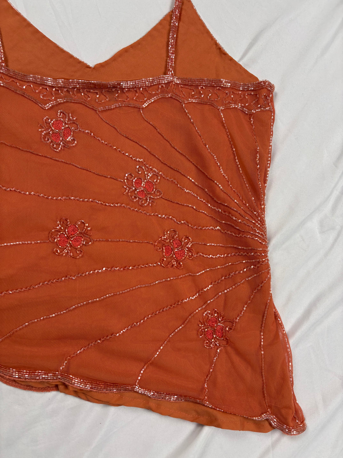 Orange asymmetric cut cami embellished with beads