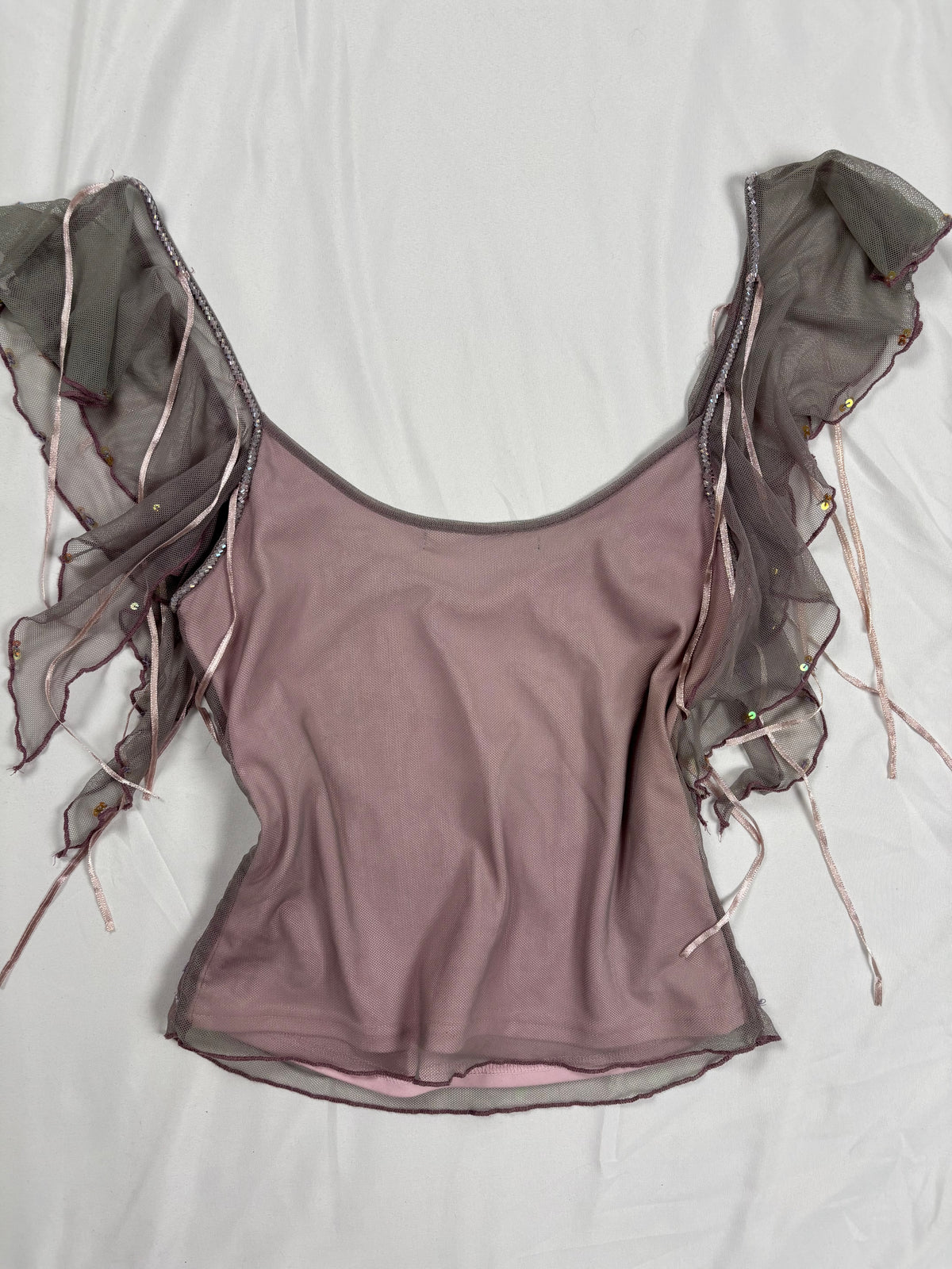 Muted purple ruffle sleeve top with embroidered sequin details