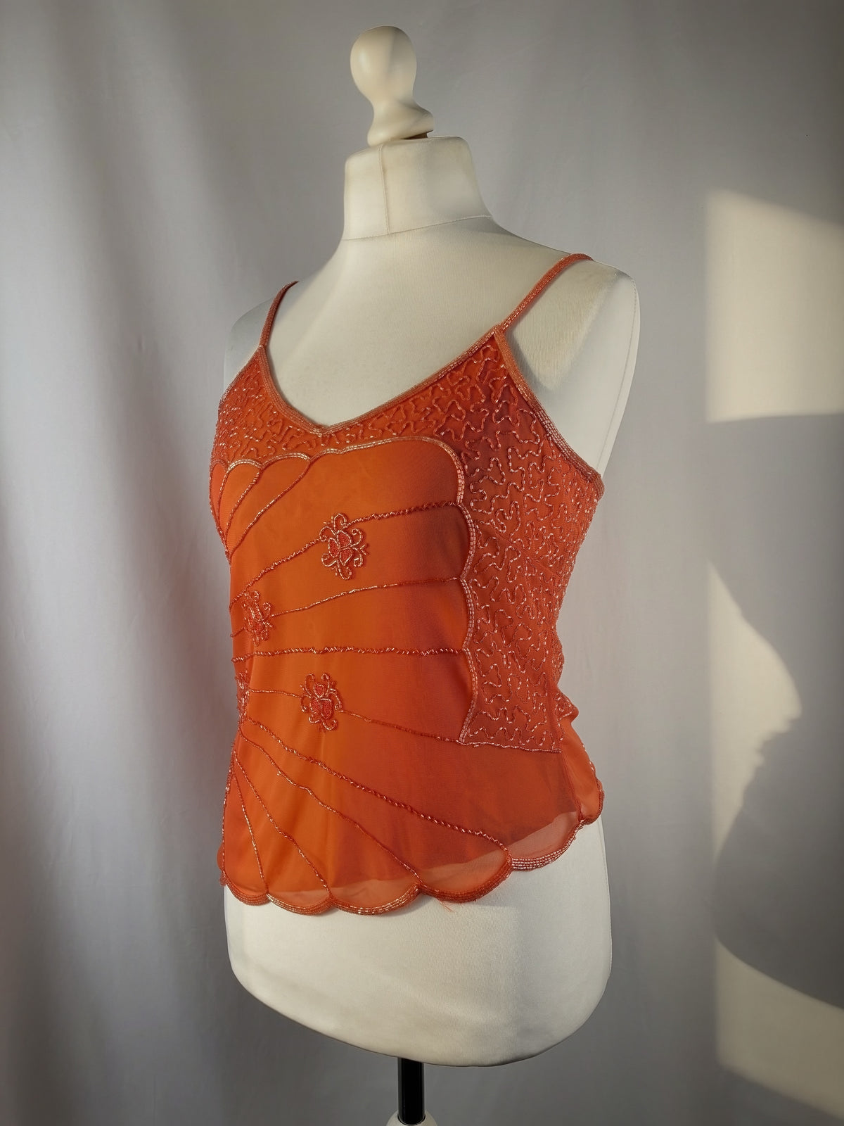 Orange asymmetric cut cami embellished with beads