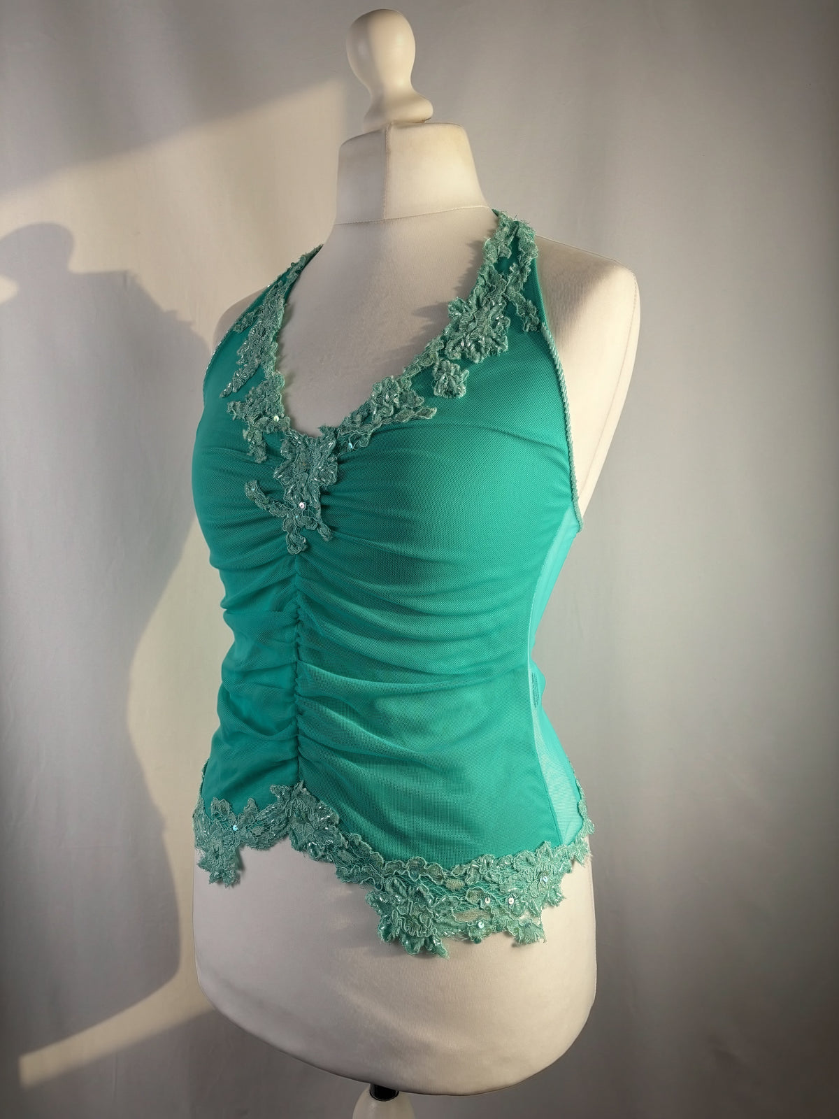 Bright blue ruched aftershock halter neck with beaded lace details