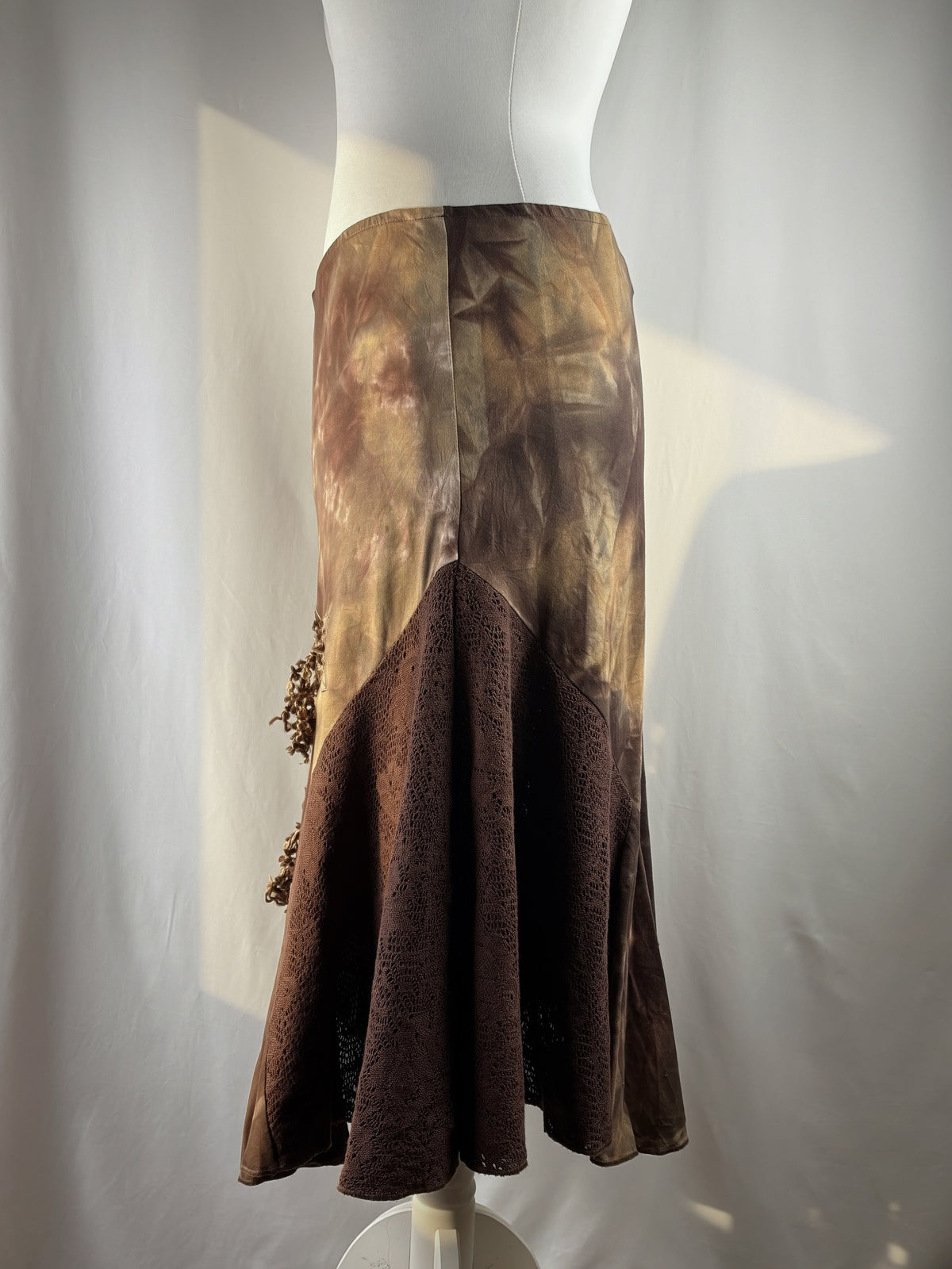 Brown and beige ombré patchwork skirt with floral tassel details