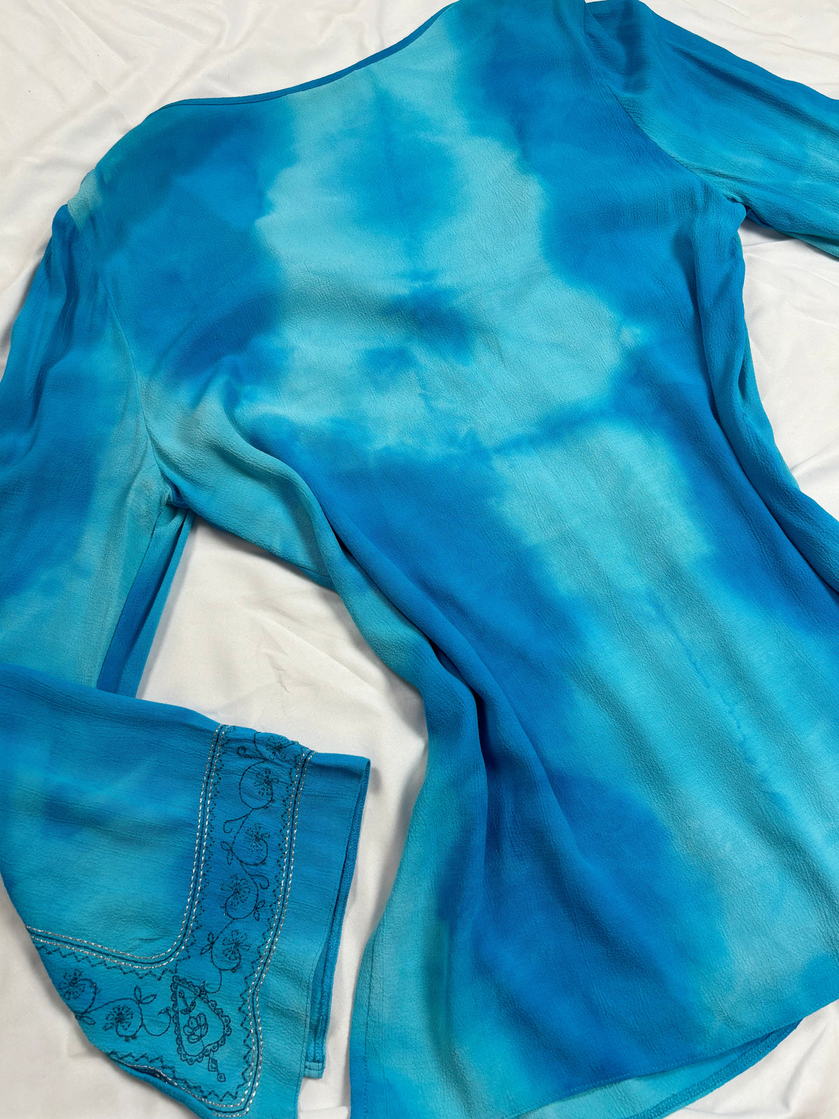Blue ombré long sleeve top with embroidery details
