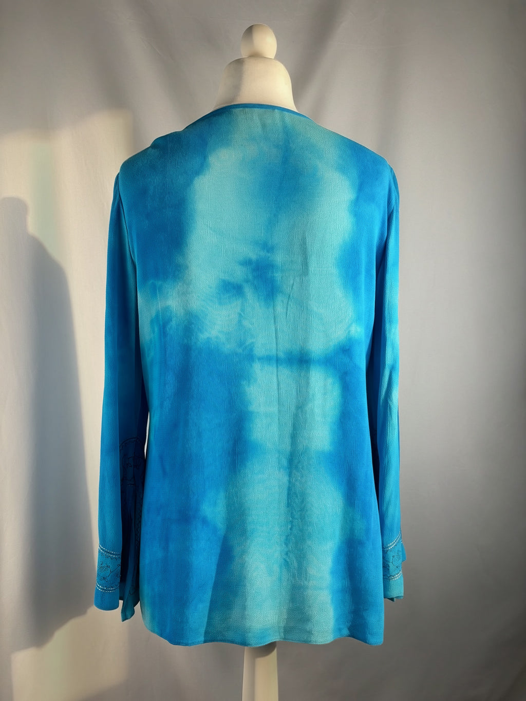 Blue ombré long sleeve top with embroidery details