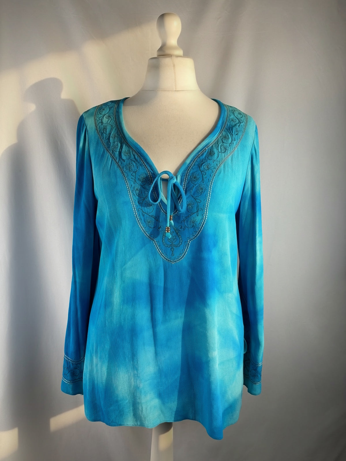 Blue ombré long sleeve top with embroidery details