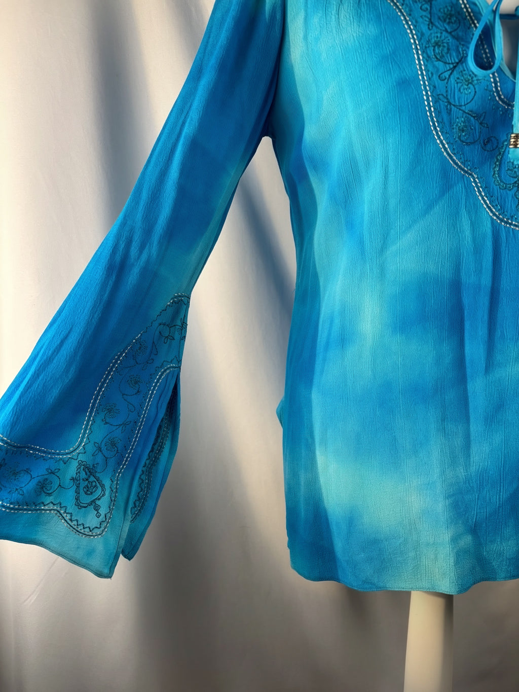 Blue ombré long sleeve top with embroidery details