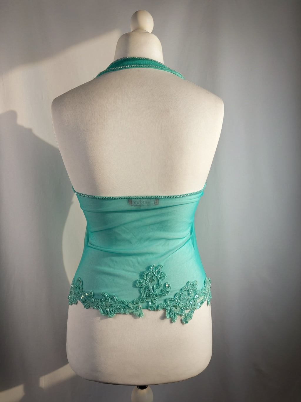 Bright blue ruched aftershock halter neck with beaded lace details