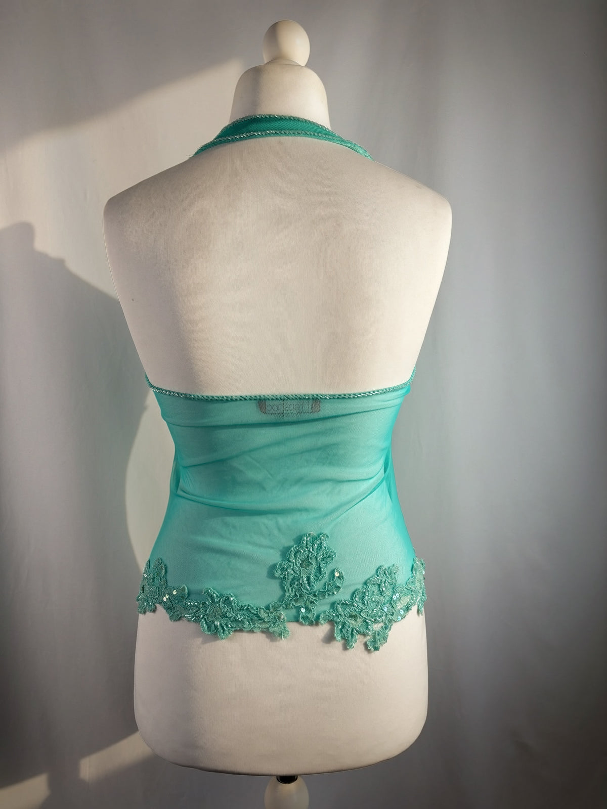 Bright blue ruched aftershock halter neck with beaded lace details
