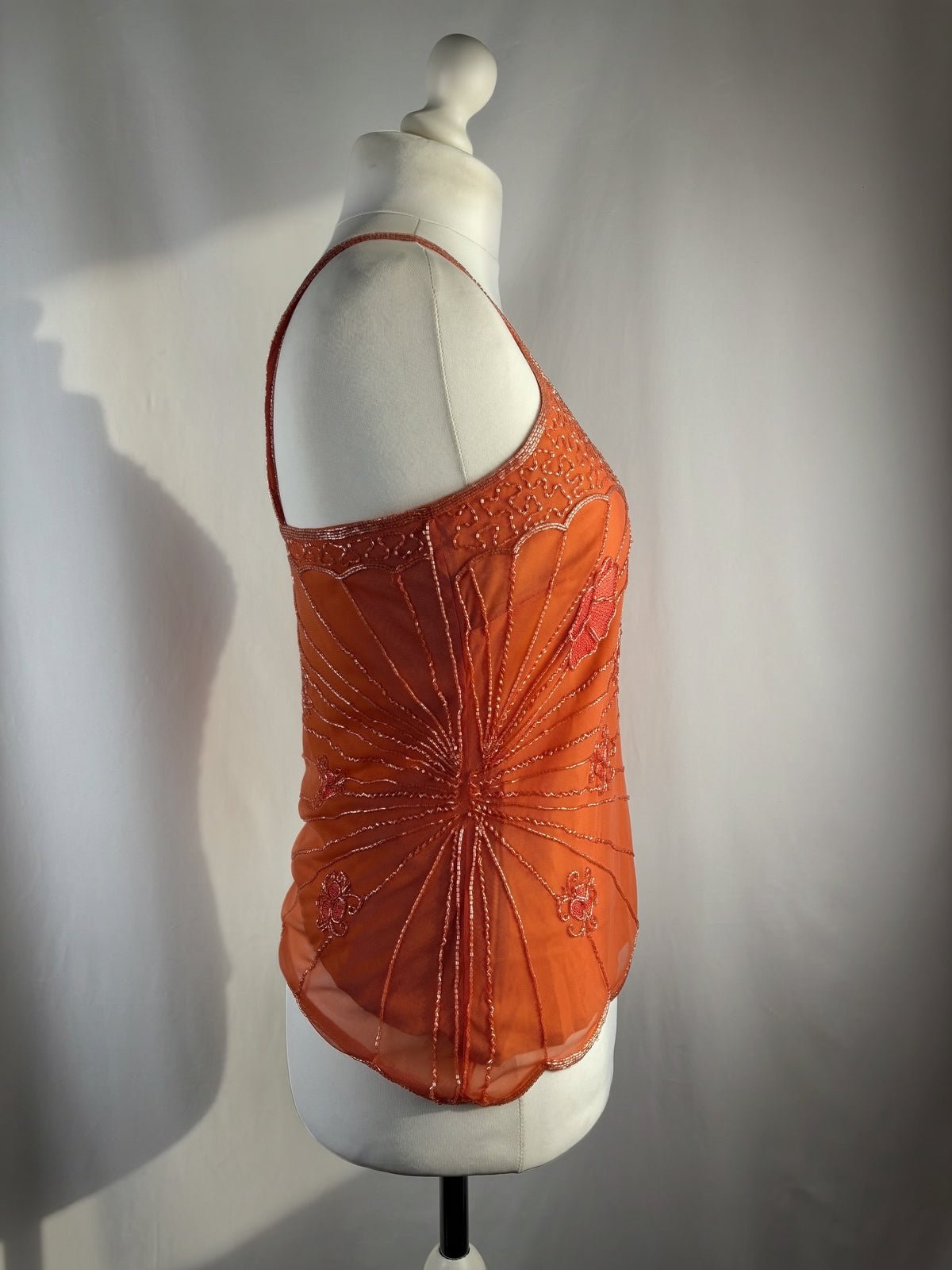Orange asymmetric cut cami embellished with beads