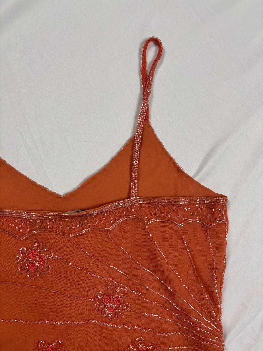 Orange asymmetric cut cami embellished with beads