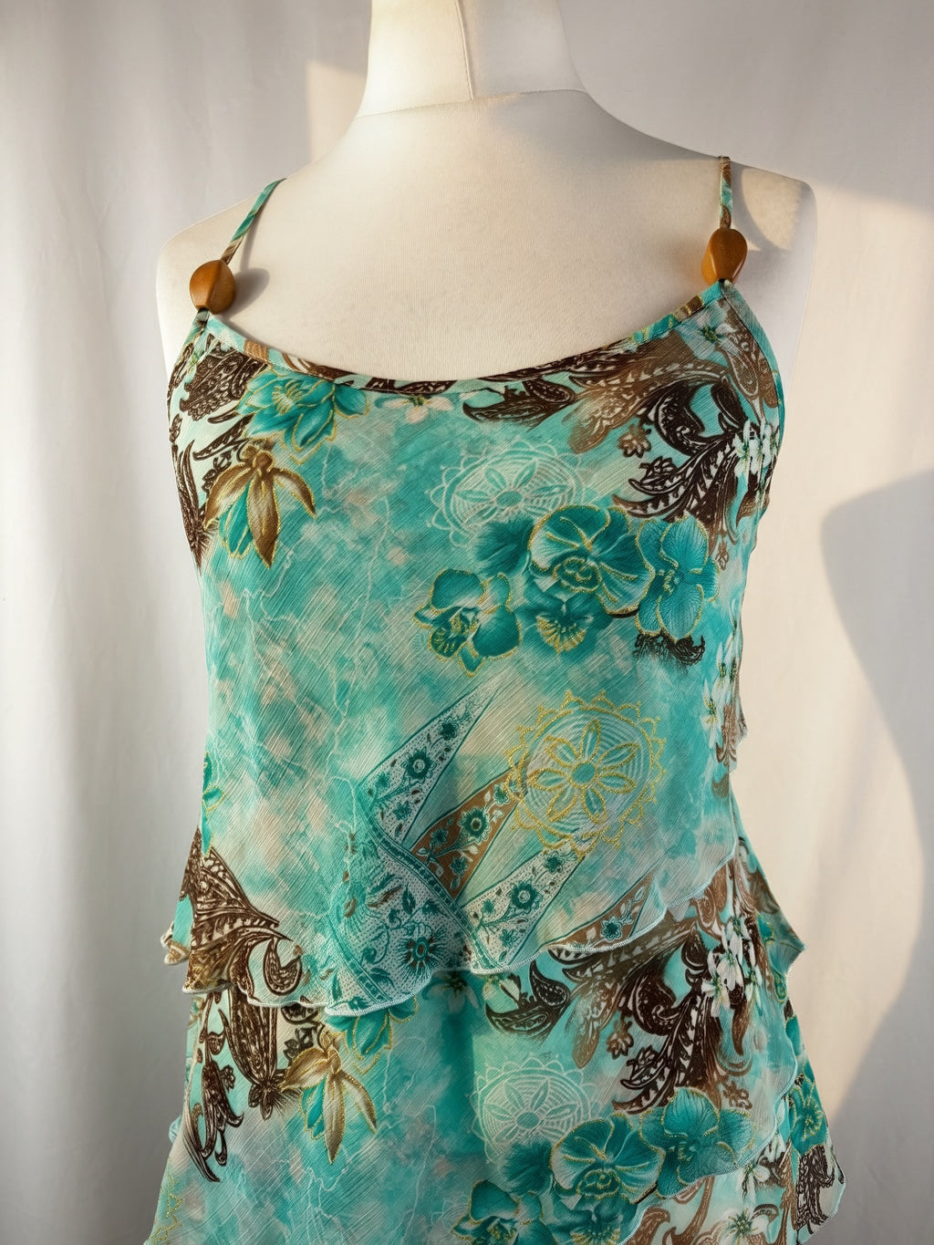 Blue and brown floral tiered ruffle cami with wooden bead details