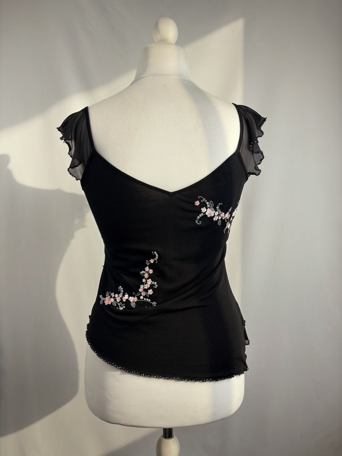 Black milkmaid neckline top with embellished cherry blossom details
