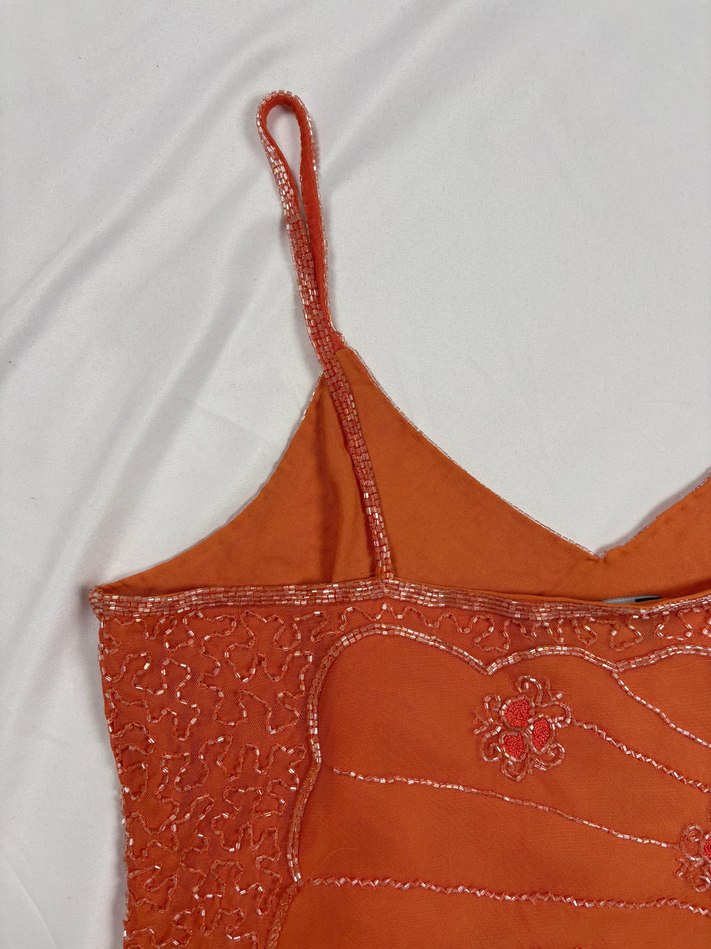 Orange asymmetric cut cami embellished with beads