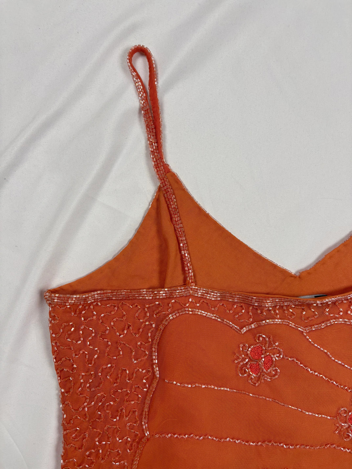 Orange asymmetric cut cami embellished with beads