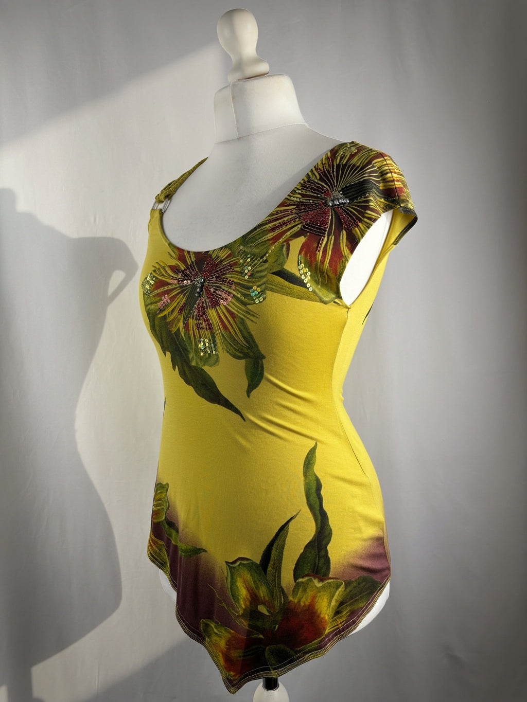Green asymmetrical tropical print embellished top with shoulder strap detail
