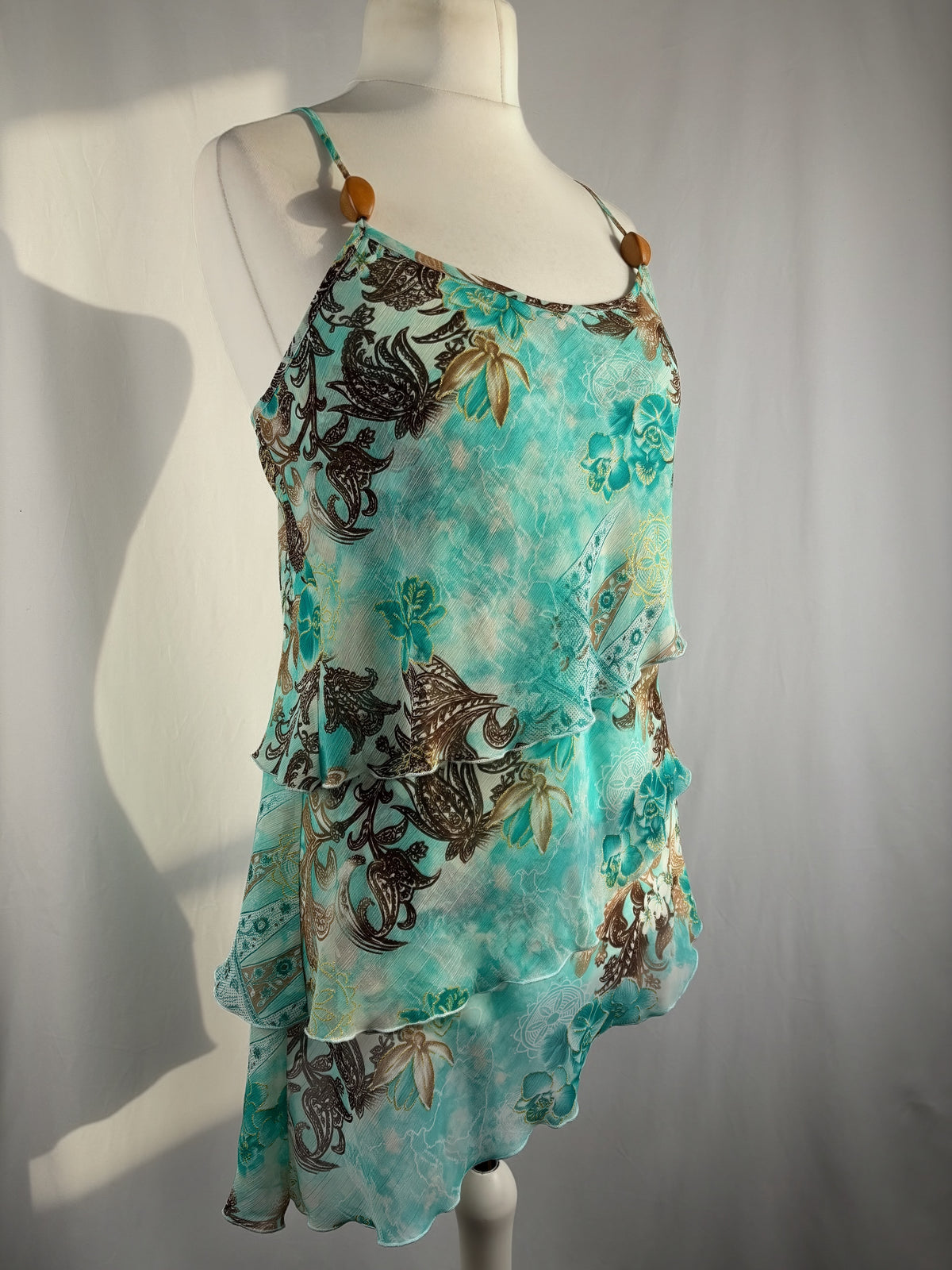 Blue and brown floral tiered ruffle cami with wooden bead details